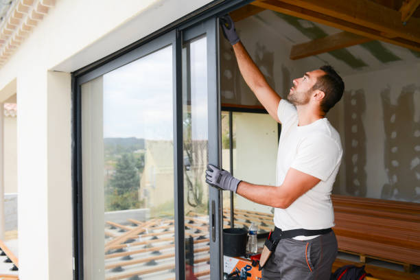 Worker Installing A door
